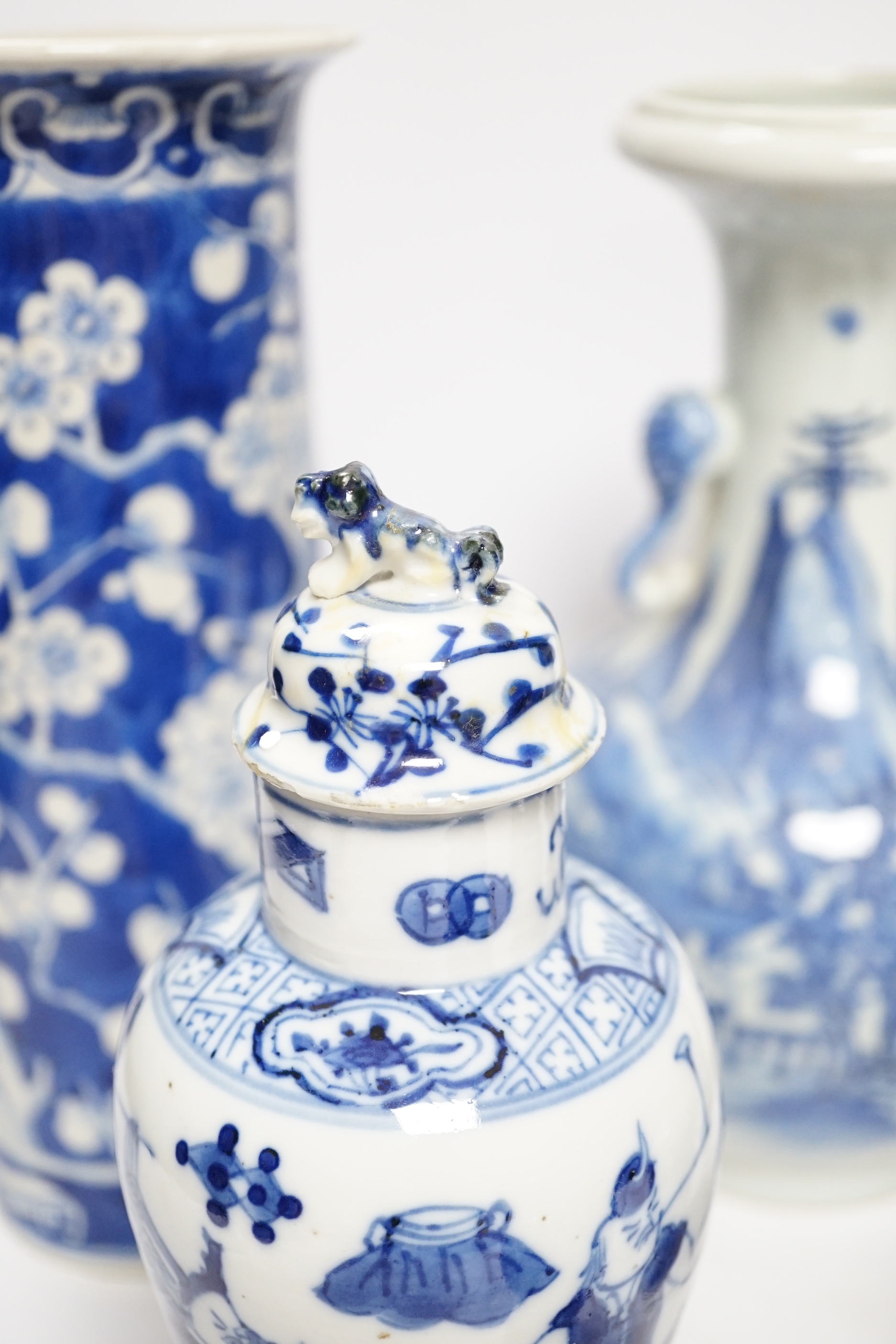 A late 19th century Chinese blue and white twin elephant head handle vase and five other 19th century Chinese blue and white vases, tallest 26cm